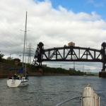 Sailboat-going-up-to-lock-RR-bridge